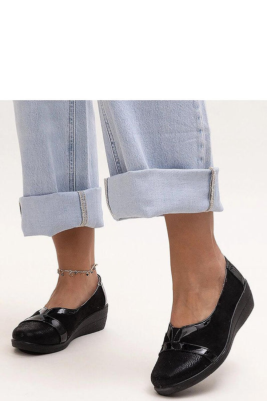 Trendy Solea Black Wedge Half Shoes with slip-on closure, ideal for versatile summer outfits, combining comfort and sophistication.