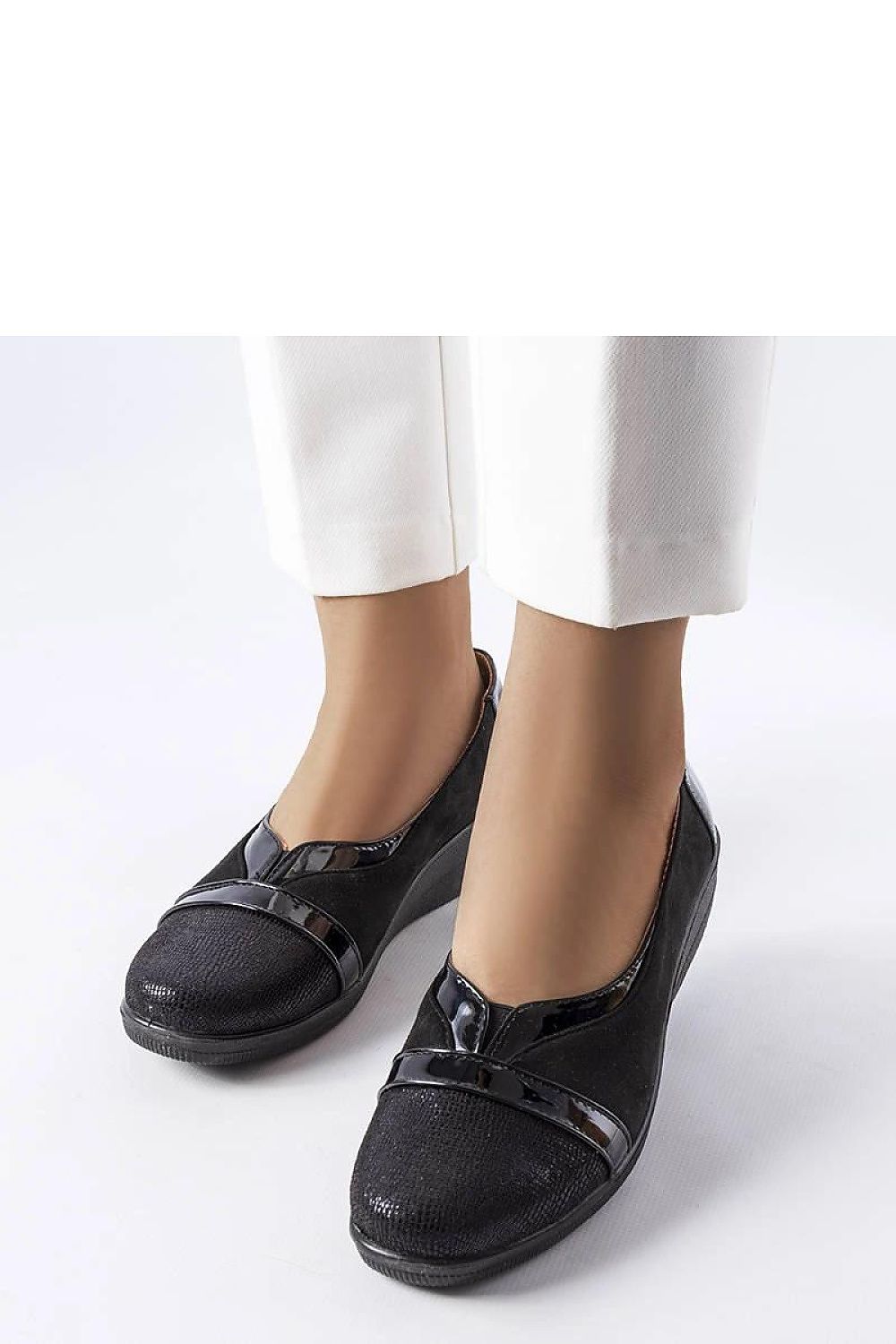 Chic Solea Black Wedge Half Shoes in the Sundown collection, crafted from high-quality materials for both casual and elegant looks.