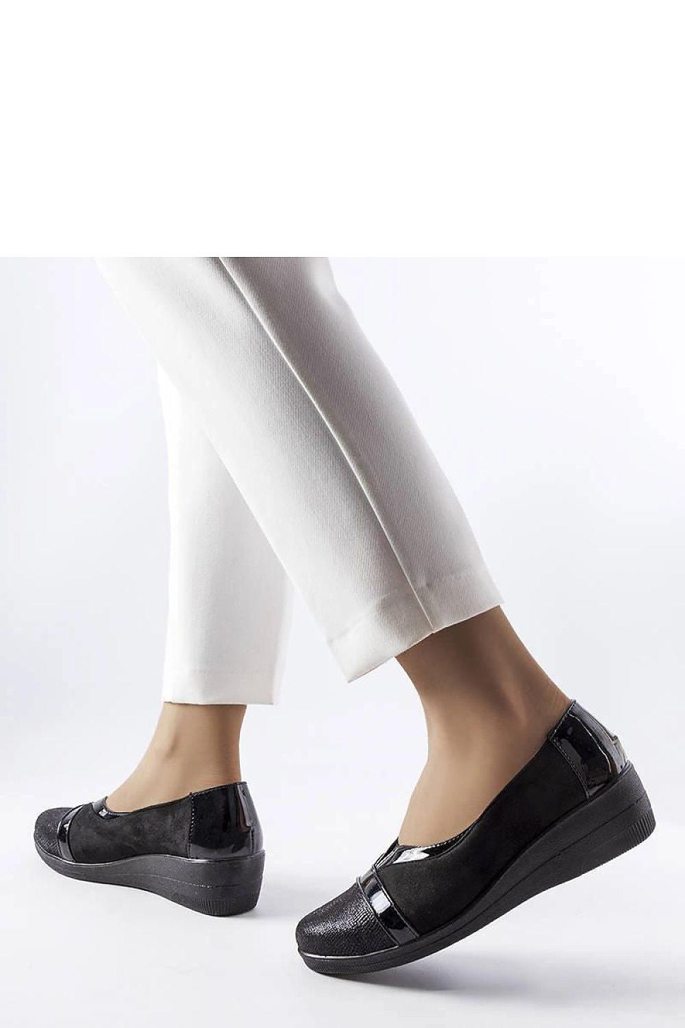 Solea Black Wedge Half Shoes elegantly presented with a black rubber sole, perfect for enhancing summer attire and providing all-day comfort.