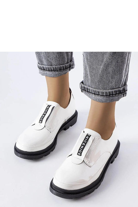 Elegant Solea white patent leather Legget loafers with a trendy tractor sole, showcasing stylish round toe design and minimalist stitching, perfect for spring-summer fashion.