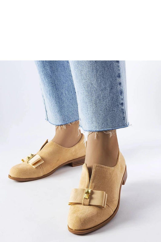Solea beige eco-leather ballet flats elegantly adorned with a bow and studs, perfect for summer styles, showcasing a luxurious design and comfort.