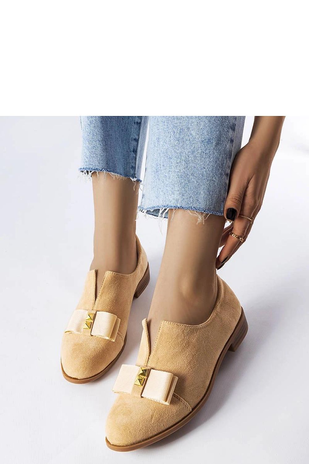 Close-up of Solea beige ballet flats featuring eco-leather material and intricate stud detailing, combining sophistication and casual elegance for everyday wear.