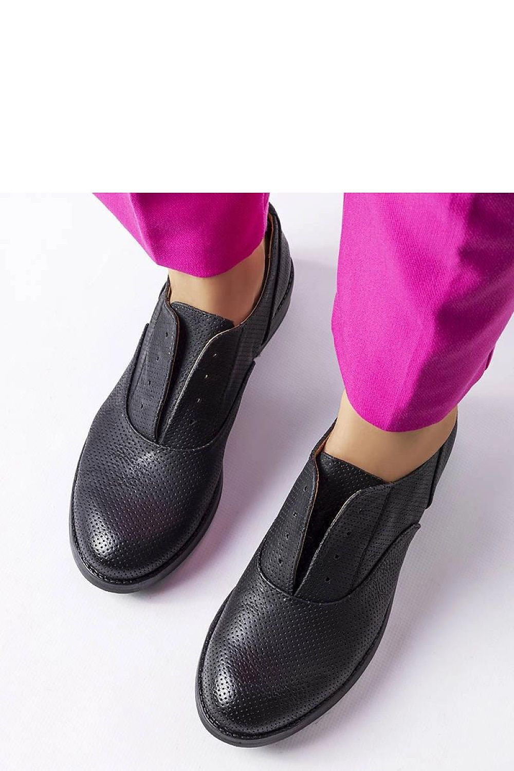 Solea women's black half shoes styled with elegant attire, highlighting their chic design and eco-friendly materials, perfect for casual to formal occasions.