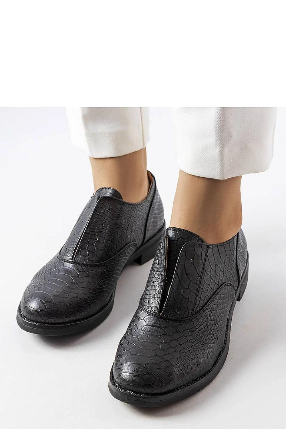 Solea Women's Morel Half Shoes in black, elegantly paired with a trendy outfit, illustrating versatile styling options for any occasion.