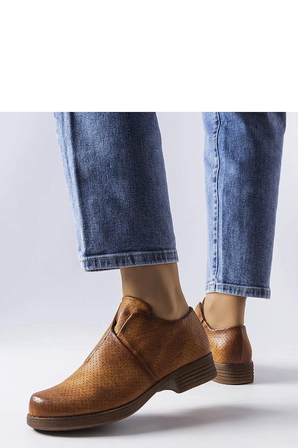 Close-up of Solea brown slip-on openwork shoes highlighting the premium eco leather texture and breathable design for luxurious summer wear.