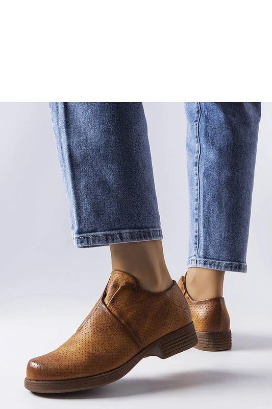 Close-up of Solea brown slip-on openwork shoes highlighting the premium eco leather texture and breathable design for luxurious summer wear.