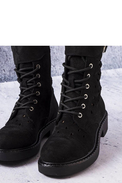 Luxury Solea black ankle boots with intricate openwork design, eco-friendly suede material, and practical rubber sole, ideal for boho-chic summer outfits.