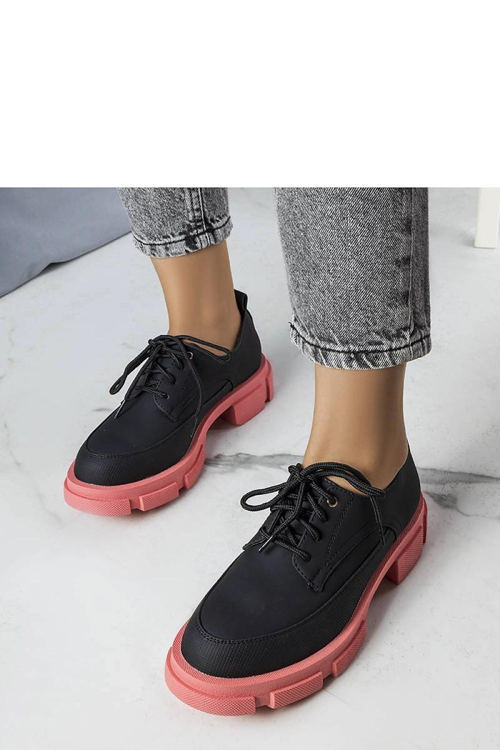 Comfortable and stylish Solea eco-leather half shoes, adorned with minimalist stitching and a round toe design.