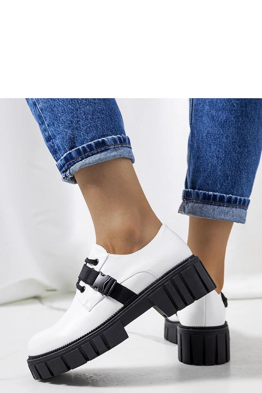 Solea comfortable half shoes in white with durable black rubber sole, ideal for summer wear and effortless style.