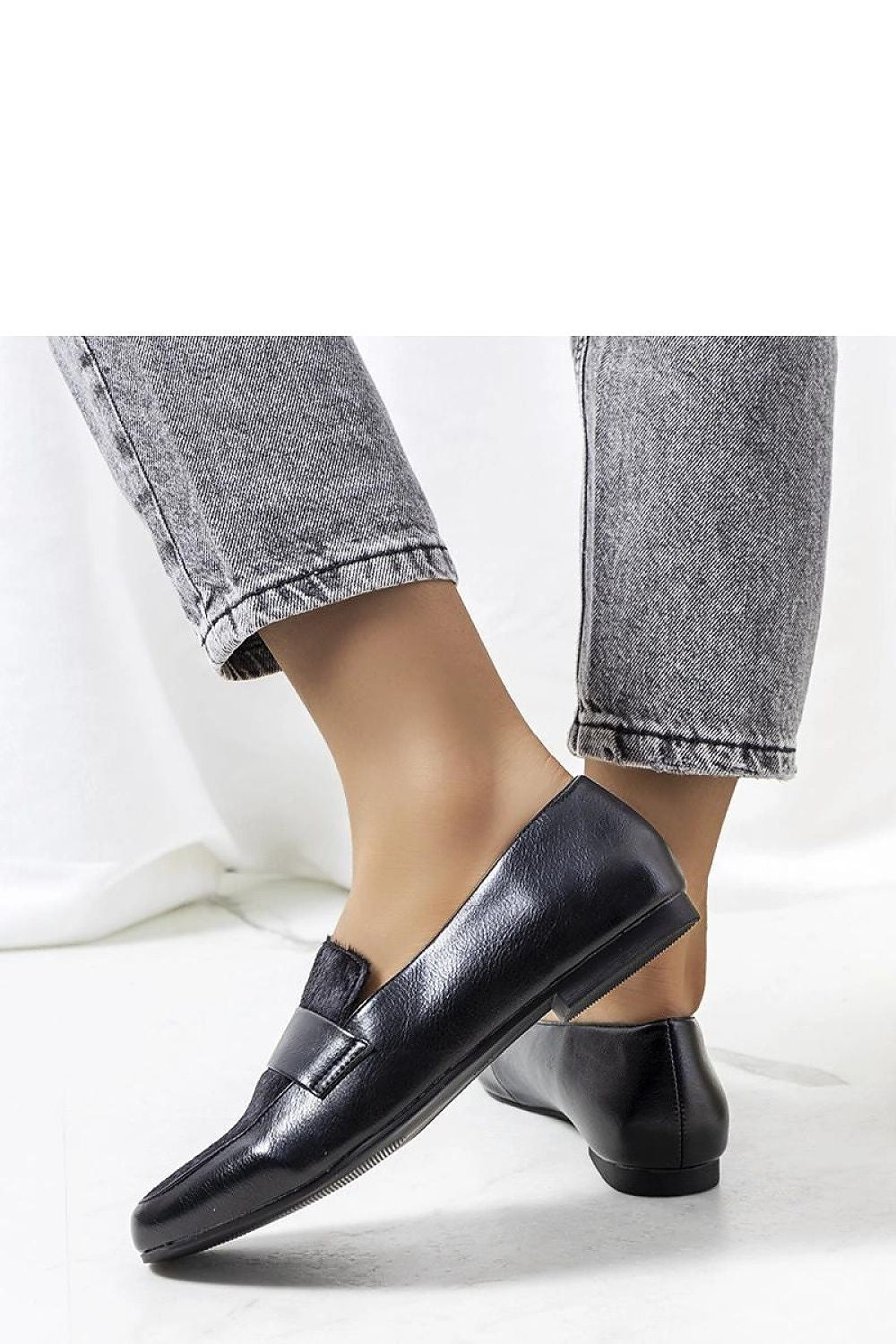 Solea black women's loafers featuring a sleek design with rubber sole for excellent grip and easy slip-on closure, ideal for sophisticated summer fashion.