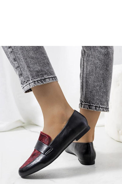 Solea Kolk Moccasins displayed on a stylish surface, highlighting their luxurious design and slip-on convenience.