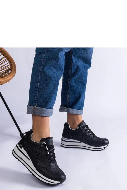 Solea black platform sneakers Ursula displayed against a chic backdrop, highlighting their versatile style suitable for various outfits.