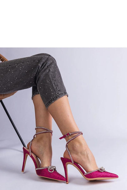 Solea Pink Glitter Stilettos featuring a chic bow design, ideal for adding sophistication to any outfit.