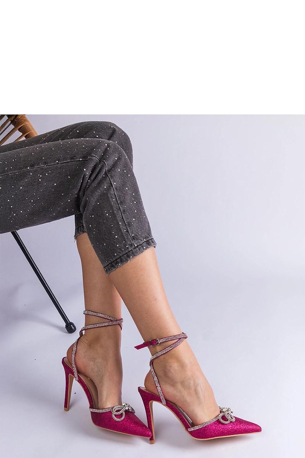 Luxury Solea pink glitter high heel pumps adorned with a delicate bow and radiant rhinestones, perfect for elegant summer occasions.