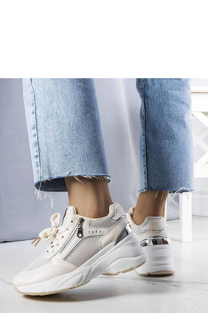 Solea Stacey beige wedge sneakers displayed on a stylish surface, ideal for creating elegant summer styles with comfort.