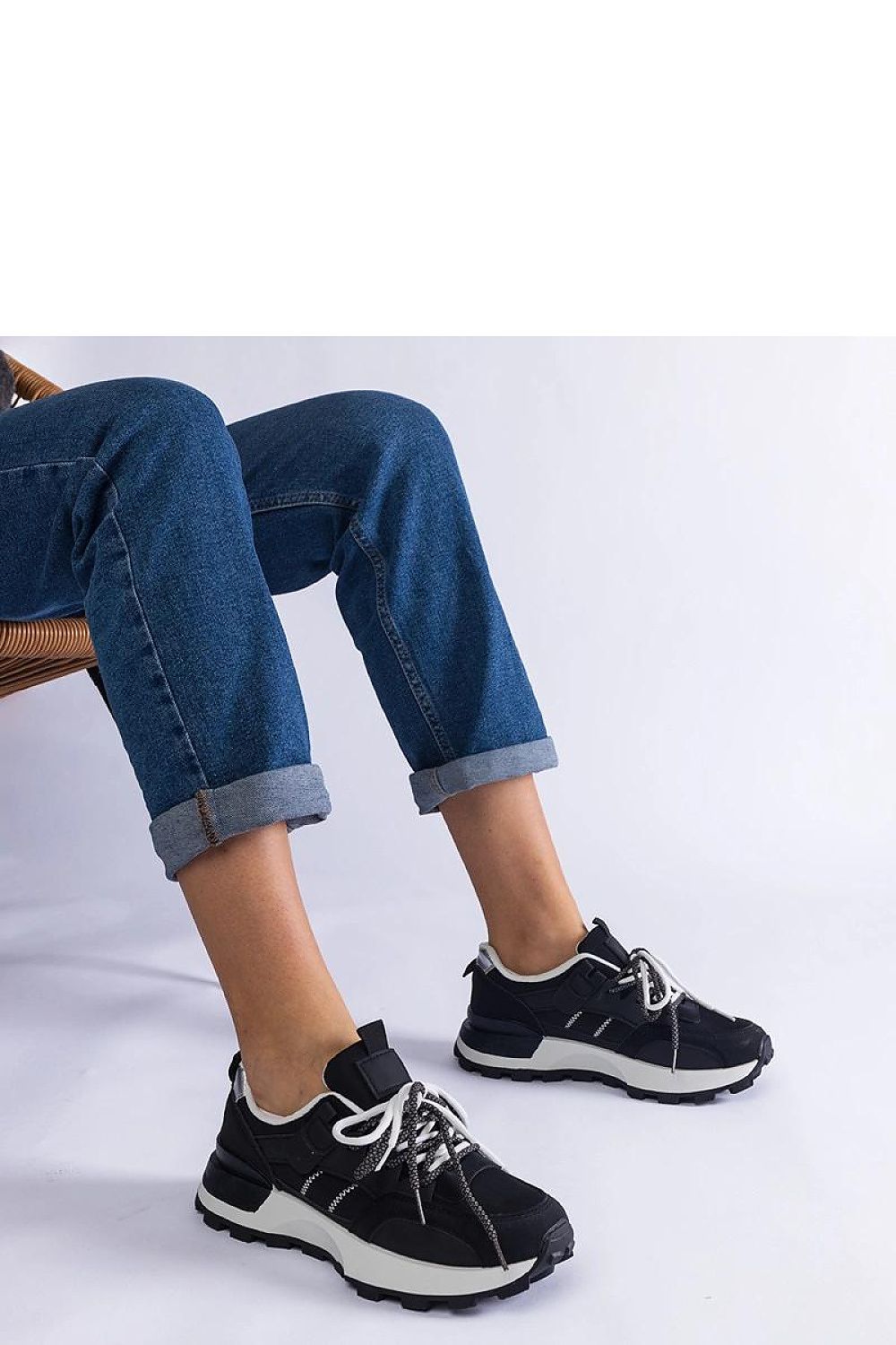 Elegant black women's sports sneakers by Solea, featuring the Adalia Hurtado design with sleek lace-up closure for comfort and style.