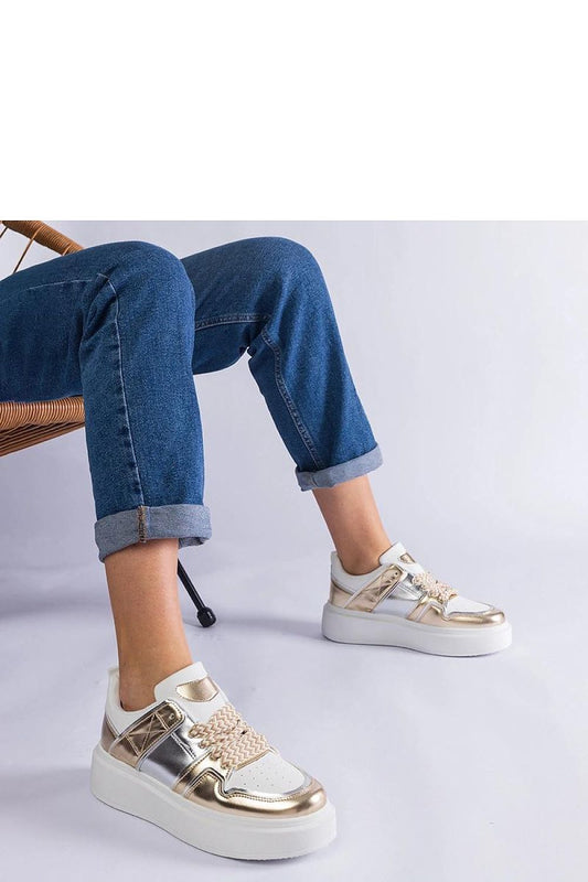 Luxurious Solea golden sneakers with silver inserts, crafted from high-quality eco-leather, featuring a comfortable 4cm heel, perfect for fashionable everyday wear or elegant occasions.