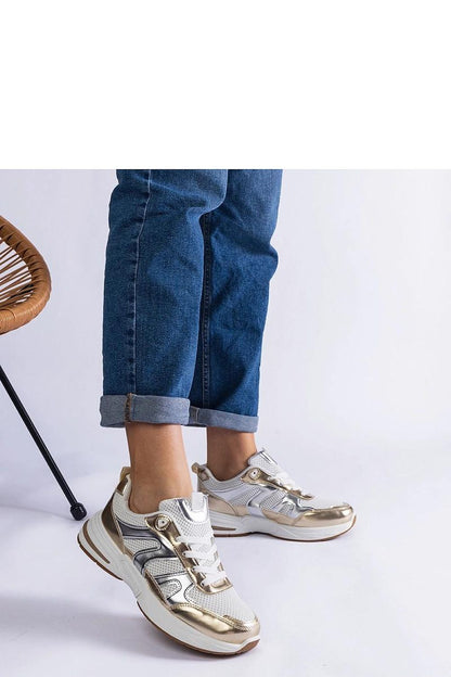 Close-up view of Solea Elayne Sports Sneakers, showcasing the refined gold detailing and stylish low cut silhouette ideal for chic athletic looks.