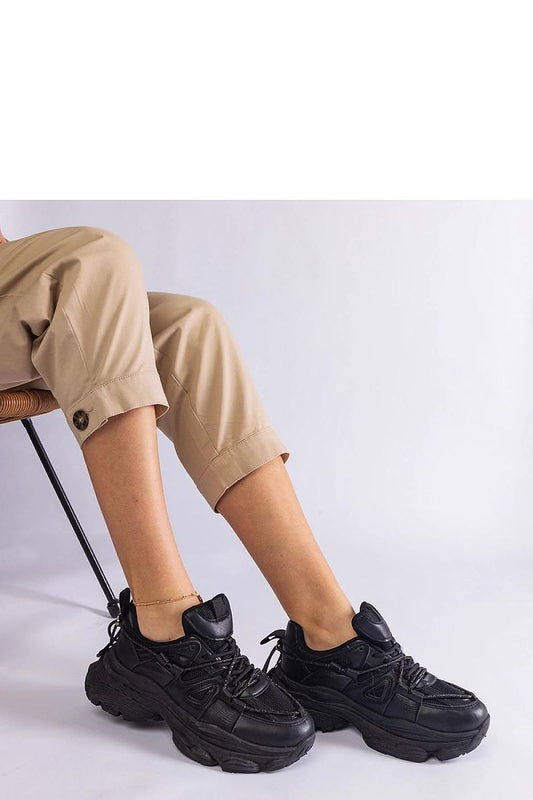 Close-up of Solea Ivett Women's Black Sports Sneakers, featuring durable rubber sole and perfect laced closure for a refined fit.