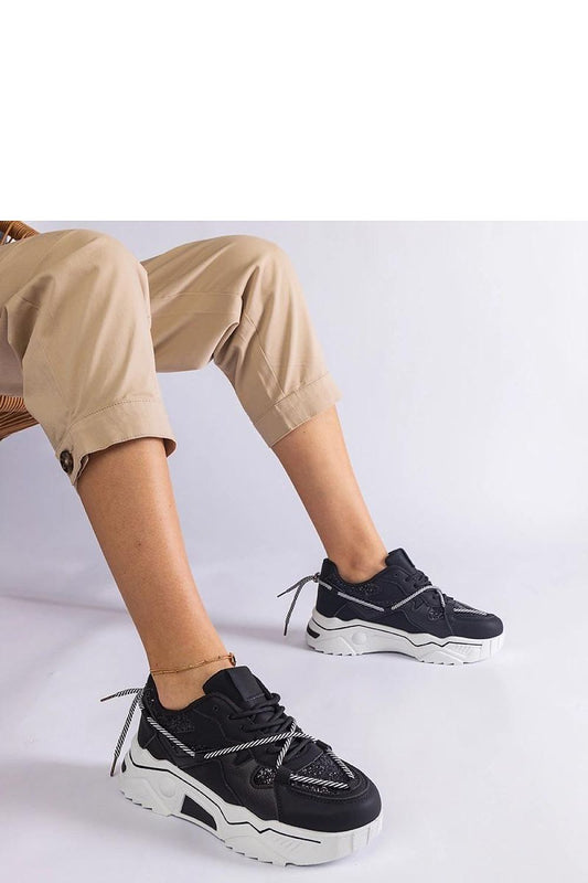 Solea Women's Black Sneakers featuring shimmering brocade design, perfect fit and comfort for stylish everyday wear, available in EU sizes 36-41.