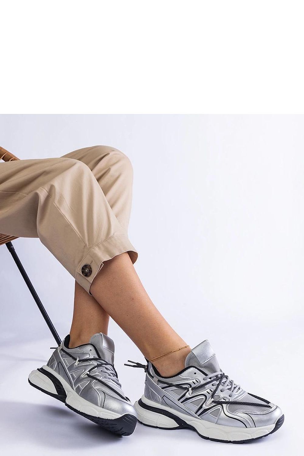 Elegant silver women's sneakers by Solea, featuring a comfortable large sole and stylish design, perfect for fashion-forward individuals.