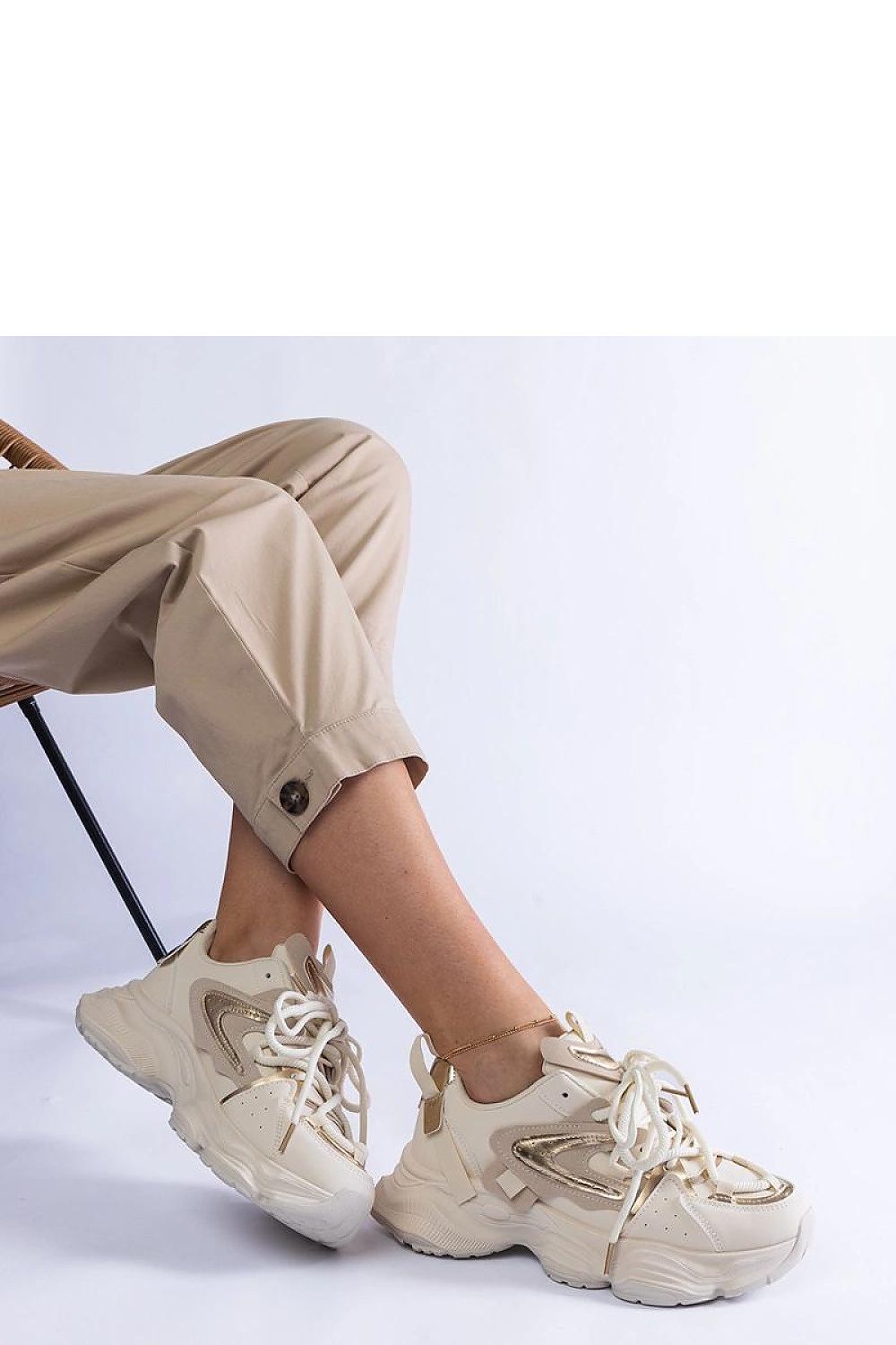 Solea Beige Women's Sports Sneakers on a massive sole, highlighting their elegant design and light, comfortable features.