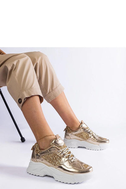 Stylish Solea golden sneakers with brocade accents, offering a 5 cm heel and designed for women seeking a chic, comfortable everyday shoe.