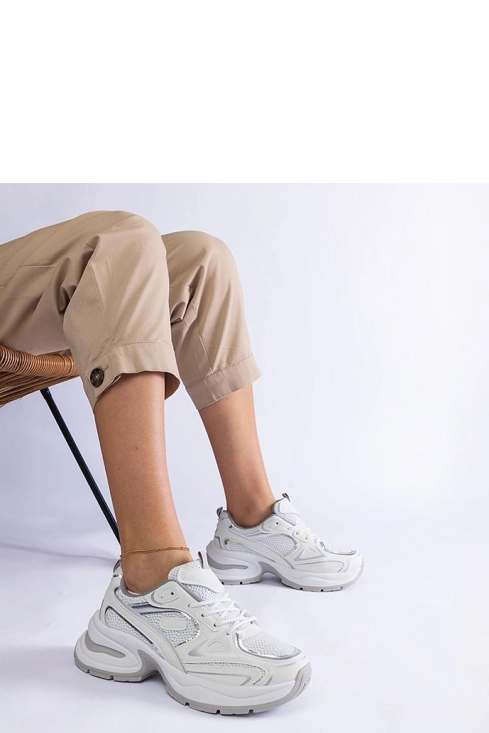 Solea Chunky Sole White Sneakers showcasing a blend of luxury and comfort, designed with a contemporary lace-up style and durable grey rubber sole, perfect for style-conscious individuals.