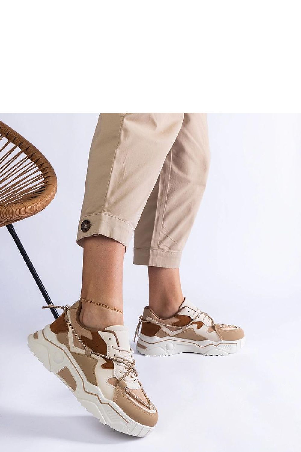 Close-up of the high-quality synthetic leather of Solea's luxury brown sneakers, showcasing the elegant design and exquisite zirconia lace details.