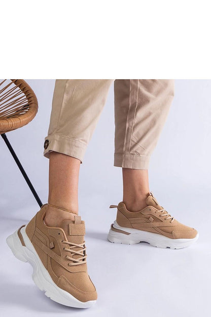 Fashionable Solea brown lace-up sneakers displayed on a stylish backdrop, highlighting their versatile design suitable for both casual and formal ensembles.