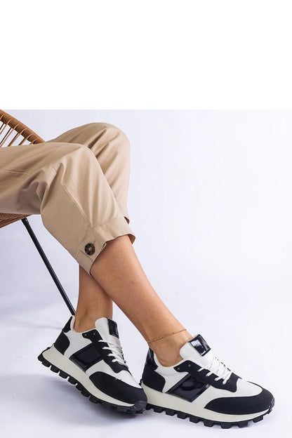 Chic Solea Black Sneakers showcasing low height and practical lacing for a secure fit, made from high-quality eco-leather for a trendy and fashionable look.