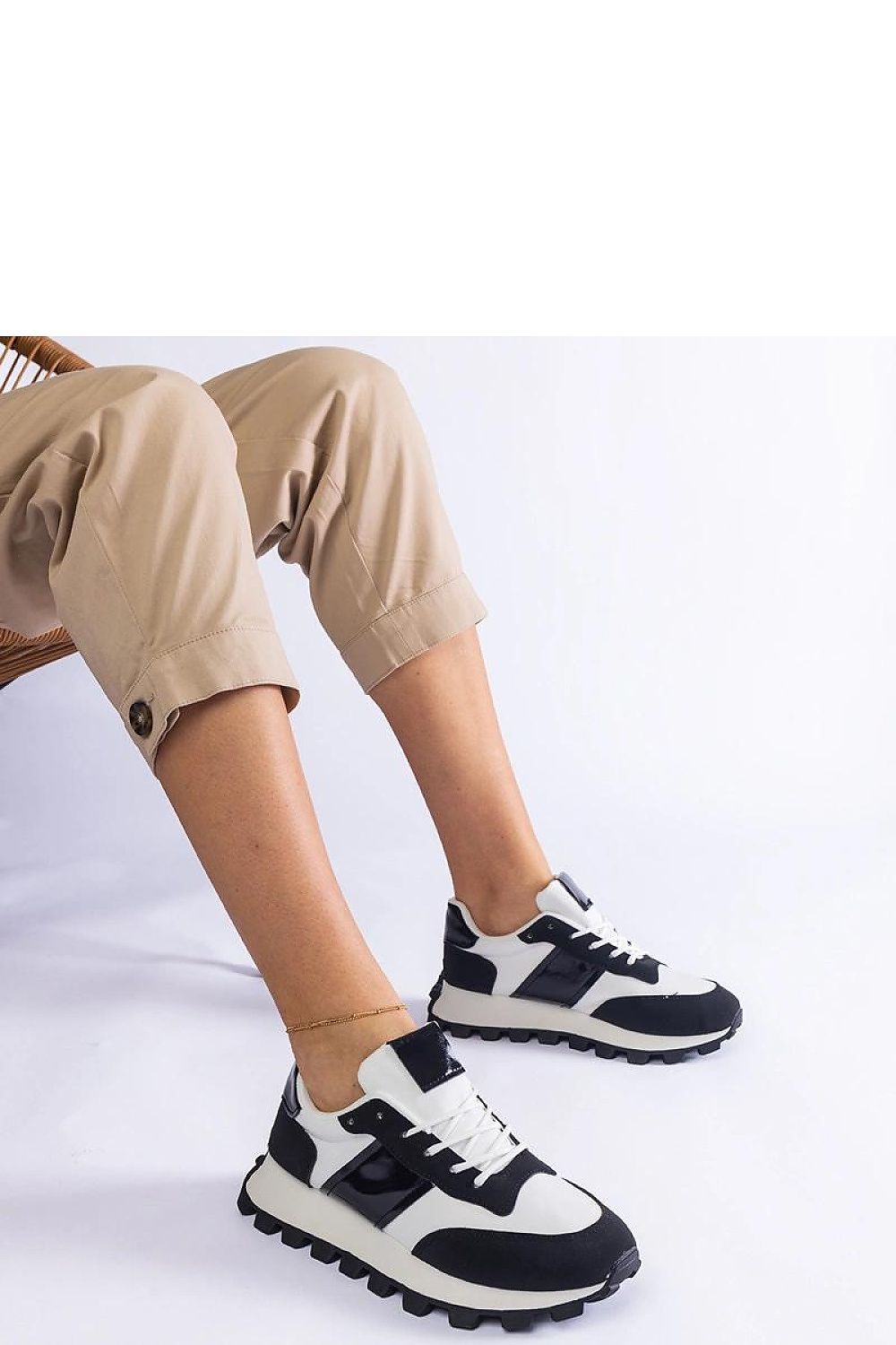 Solea luxury black sneakers showcasing a stylish Restia protector, crafted from high-quality eco-leather with a durable rubber sole, perfect for both casual outings and elegant everyday wear.