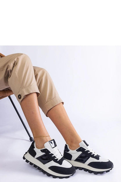 Close-up of Solea black sneakers highlighting their eco-leather finish and practical lacing, designed for comfort and fashion with a low height perfect for warmer days.