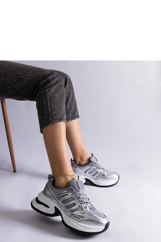 Luxury Solea women's sporty silver sneakers showcasing a modern design, perfect for blending comfort with style.