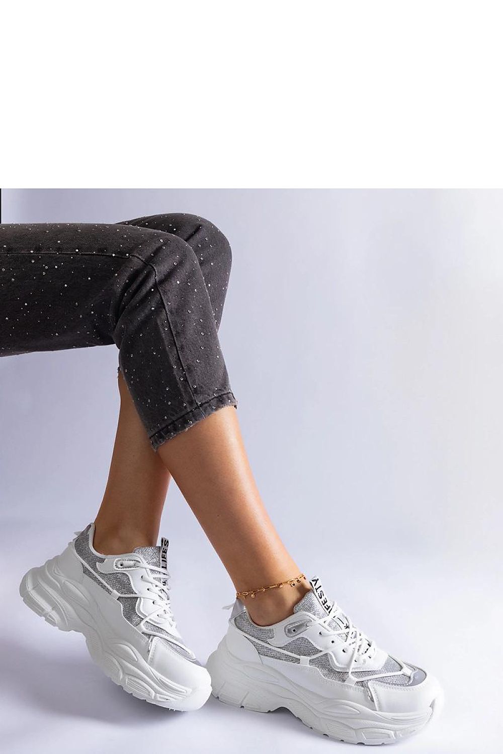 Solea designer sneakers in black, with brocade accents, perfect for both casual outings and formal occasions.