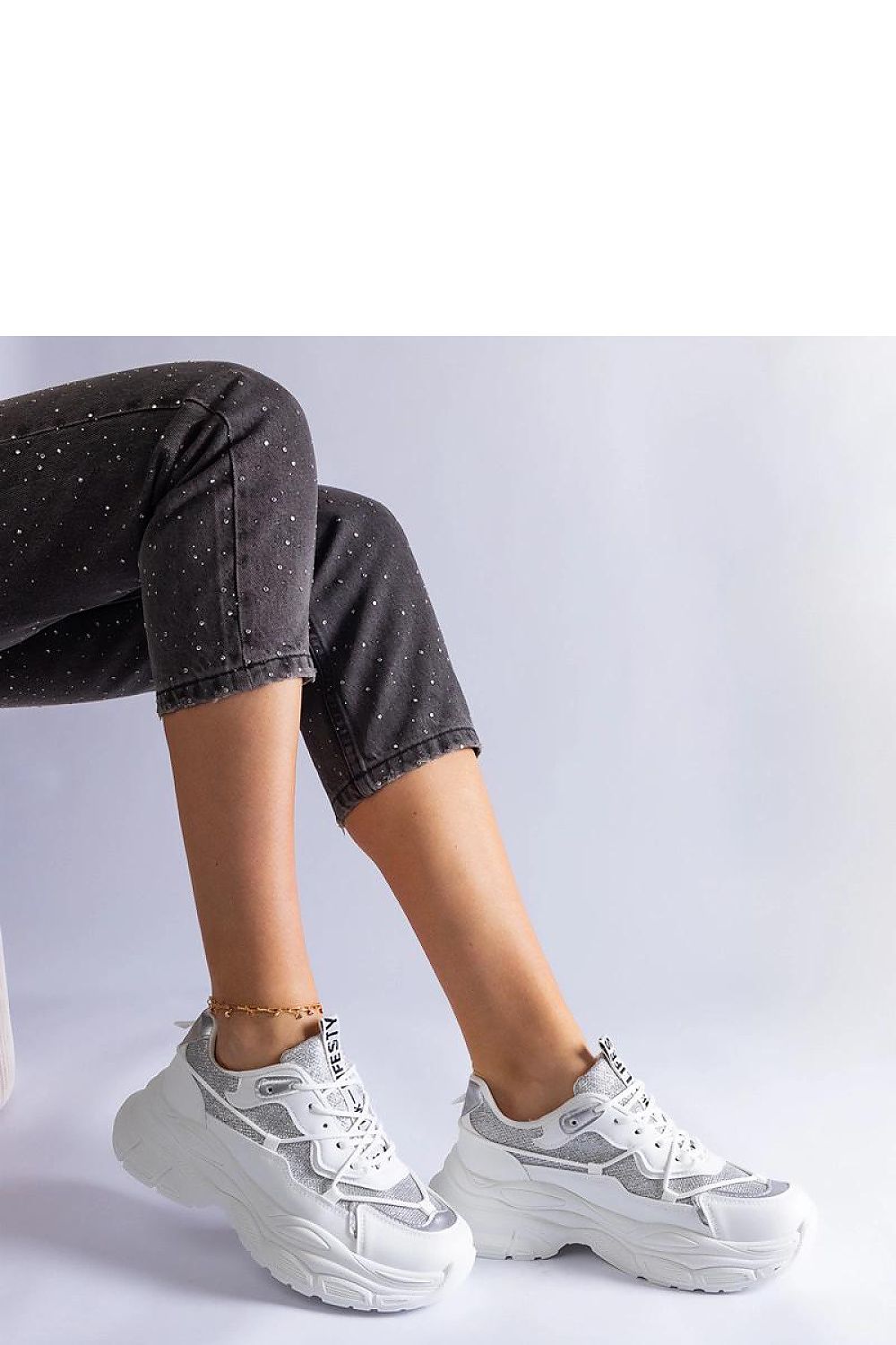 Solea elegant black sneakers featuring luxurious brocade inserts, showcasing designer style and high-quality faux leather craftsmanship.