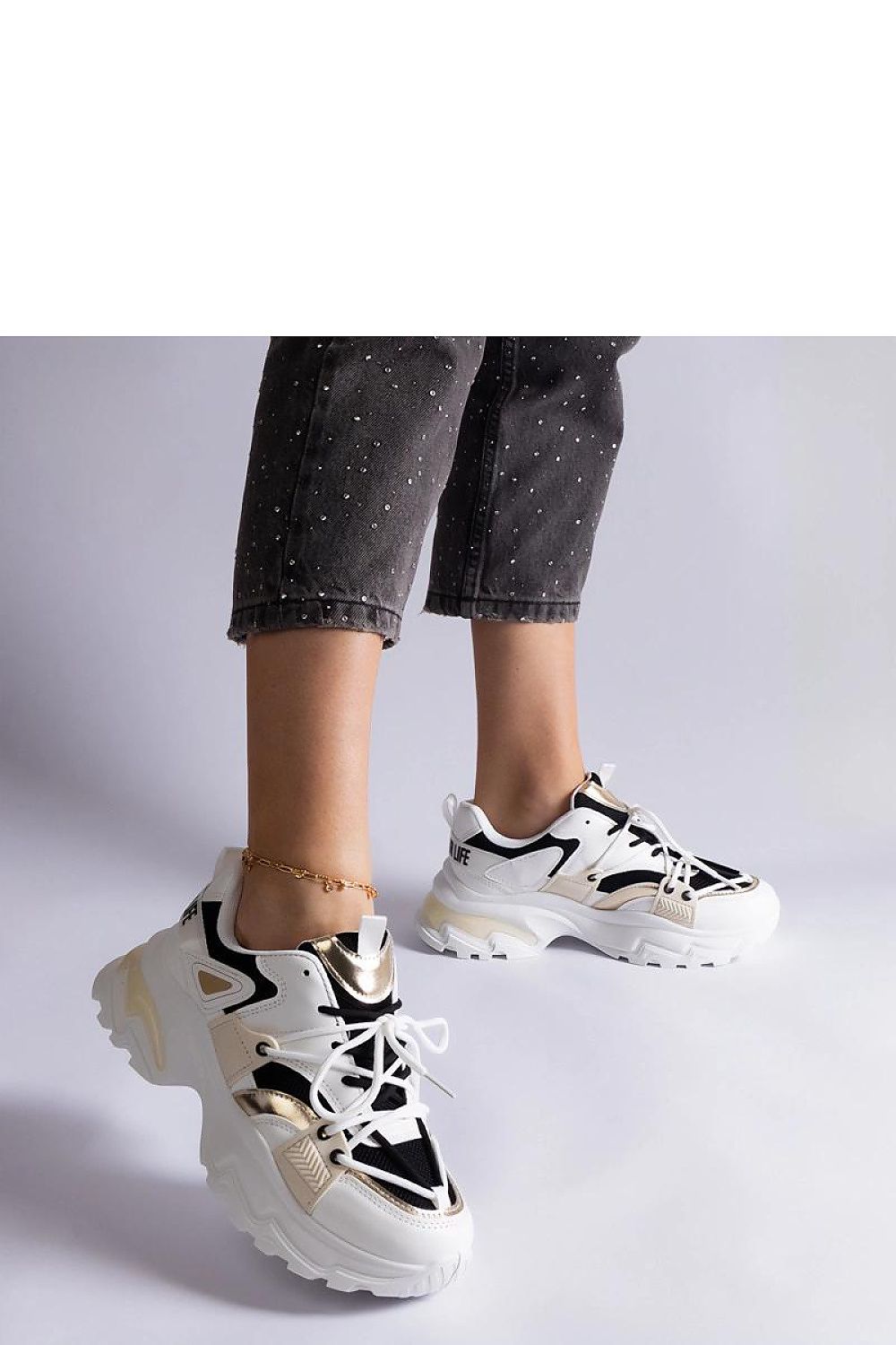 Solea Black and White Sports Sneakers modelling a chic casual outfit, perfect for dynamic lifestyles.
