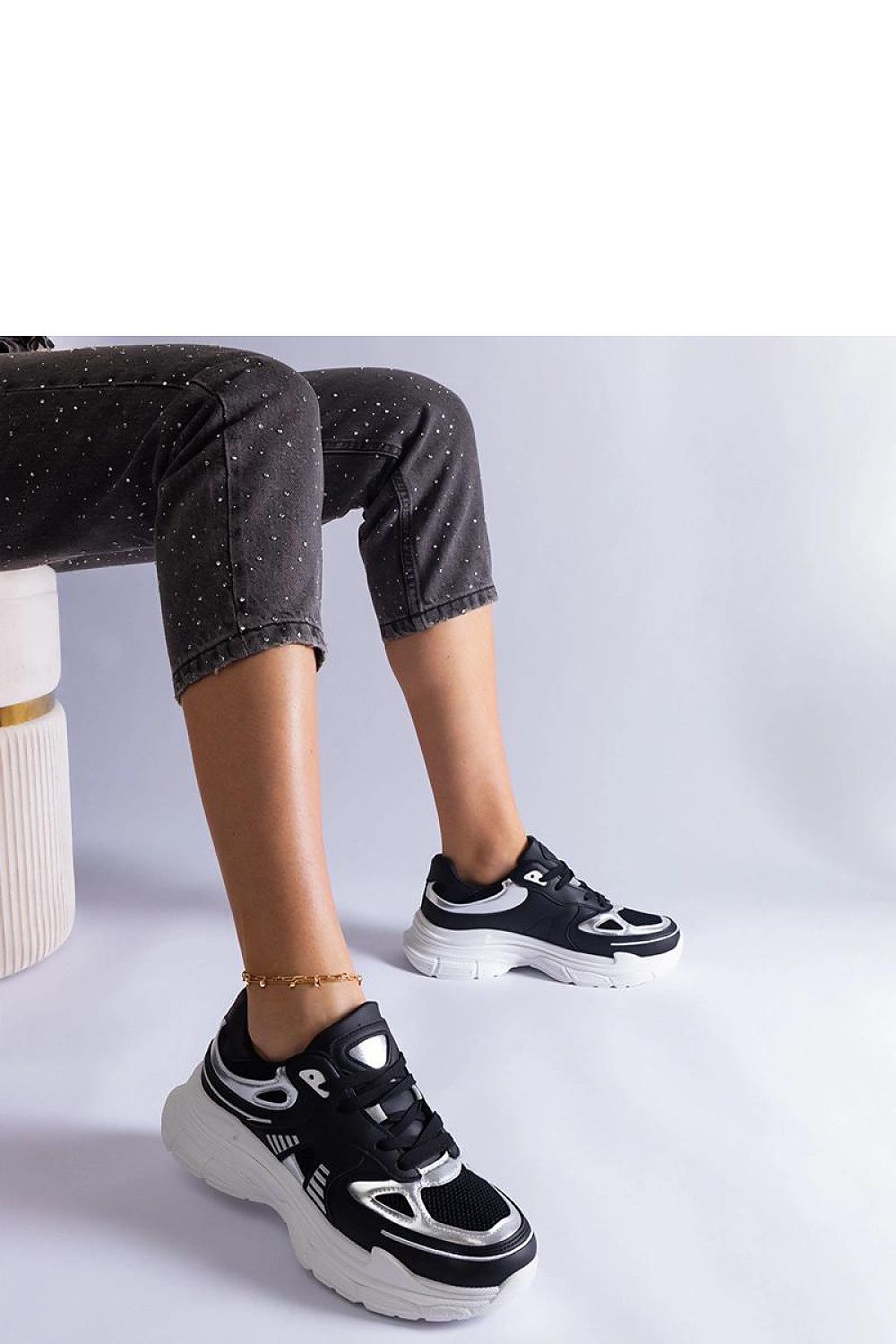 Solea luxurious stylish black women's sneakers with striking silver inserts, crafted from high-quality synthetic leather, perfect for everyday and special occasions.