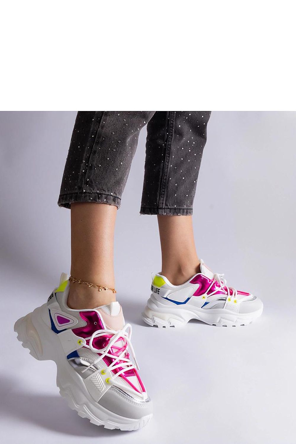 Solea stylish sports sneakers positioned against a modern backdrop, emphasising their trendy aesthetic for casual outfits.