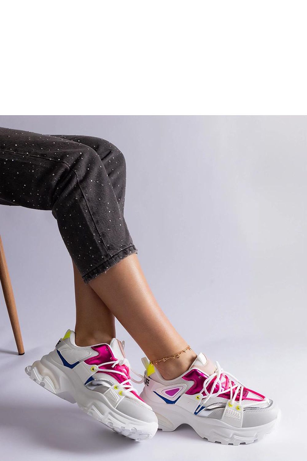 Profile view of Solea black and white athletic shoes, illustrating their chic design and quality craftsmanship, perfect for sporty fashion.