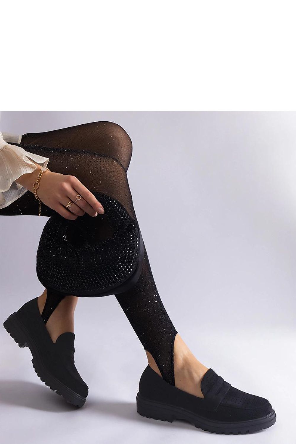 Stylish Solea Black Eco Suede Moccasins displayed with detailed craftsmanship, suitable for casual or formal occasions.