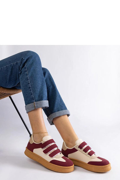 Close-up of Solea golden sneakers made from high-quality eco-leather, highlighting the exquisite craftsmanship and luxurious look.