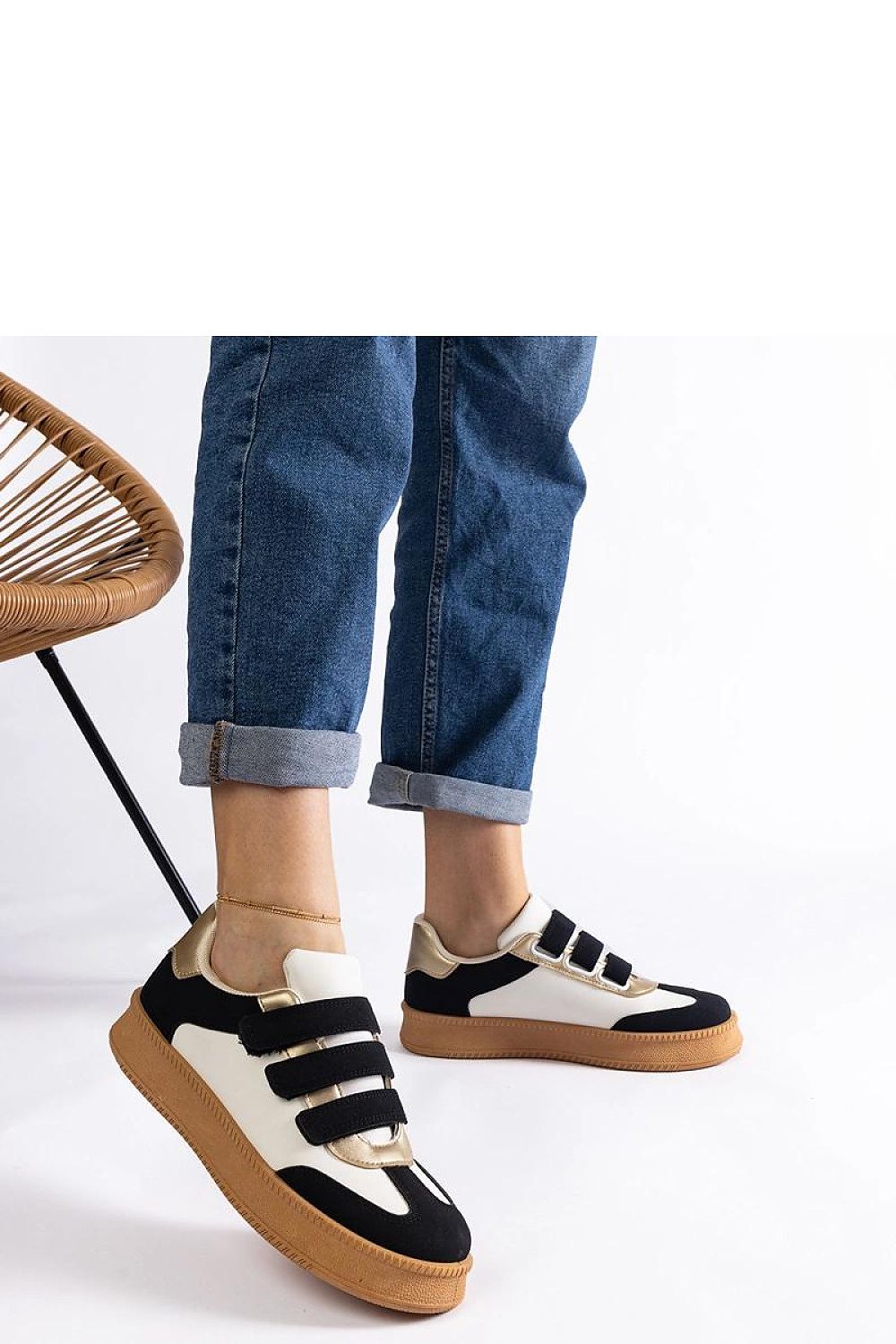 Close-up of Solea eco-leather golden sneakers, highlighting their stylish low design perfect for both casual and elegant wear.