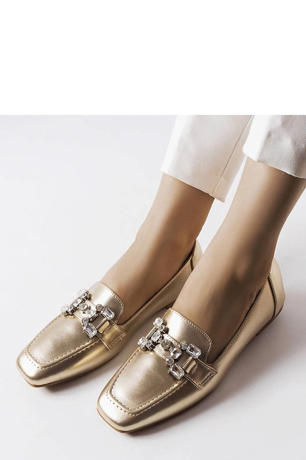 Solea stylish gold slip-on moccasins on a brown synthetic sole, designed for comfort and sophistication in every step.