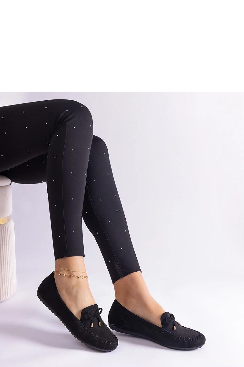 Side view of Solea's elegant beige moccasins with bow, showcasing the almond toe and rubber sole ideal for summer outings.