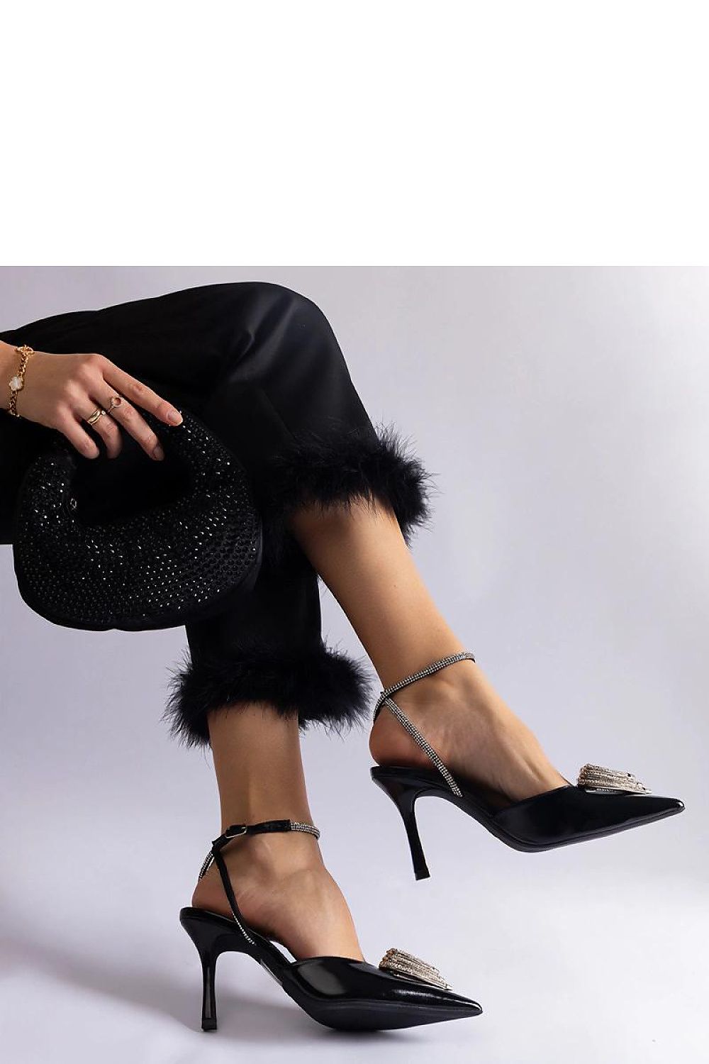 Chic Solea high heel pumps with a stunning open heel and zircon detailing, designed for the modern elegant woman.