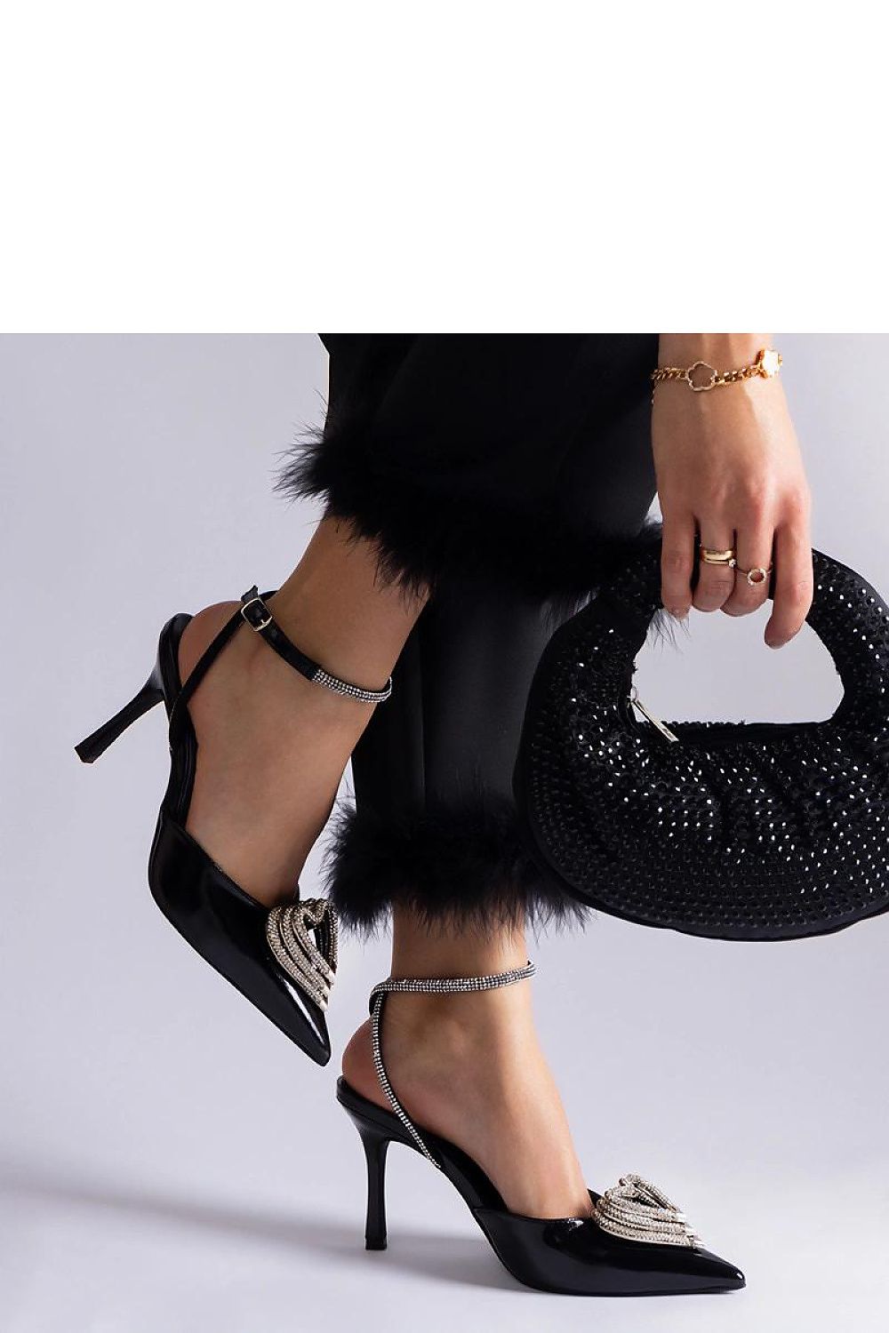 Close-up view of Solea high heel pumps with dazzling zircon details, showcasing luxurious black synthetic leather and added elegance for formal occasions.