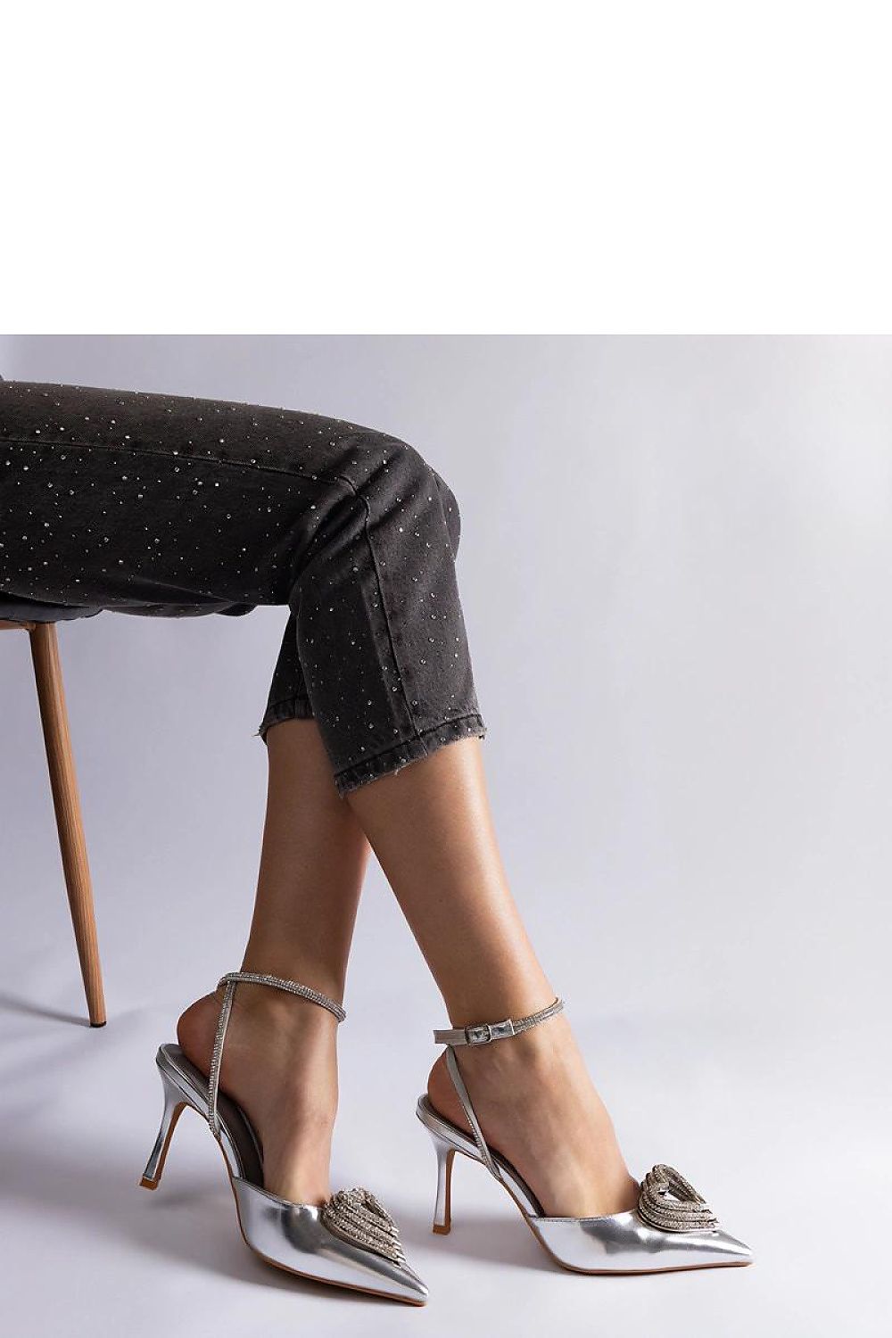 Side view of Solea high heels showcasing luxurious zircon details and comfortable buckle closure, crafted for impeccable style.