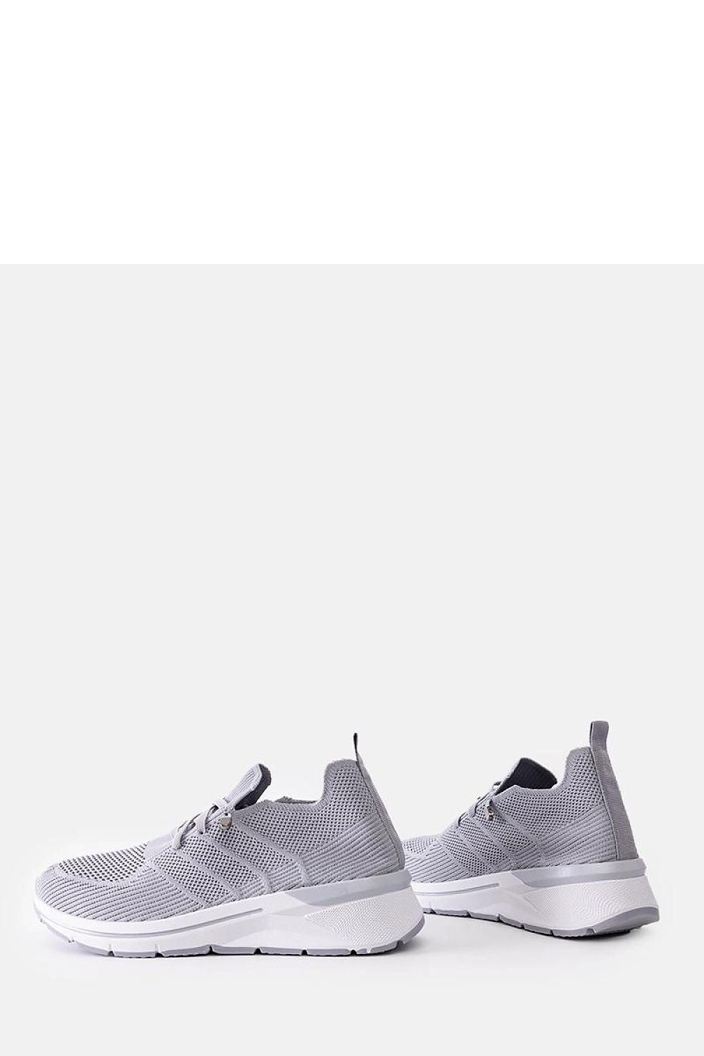 Chic Solea Grey Slip-On Sneakers, featuring a modern slip-on design that reflects luxury and practicality for summer outings.