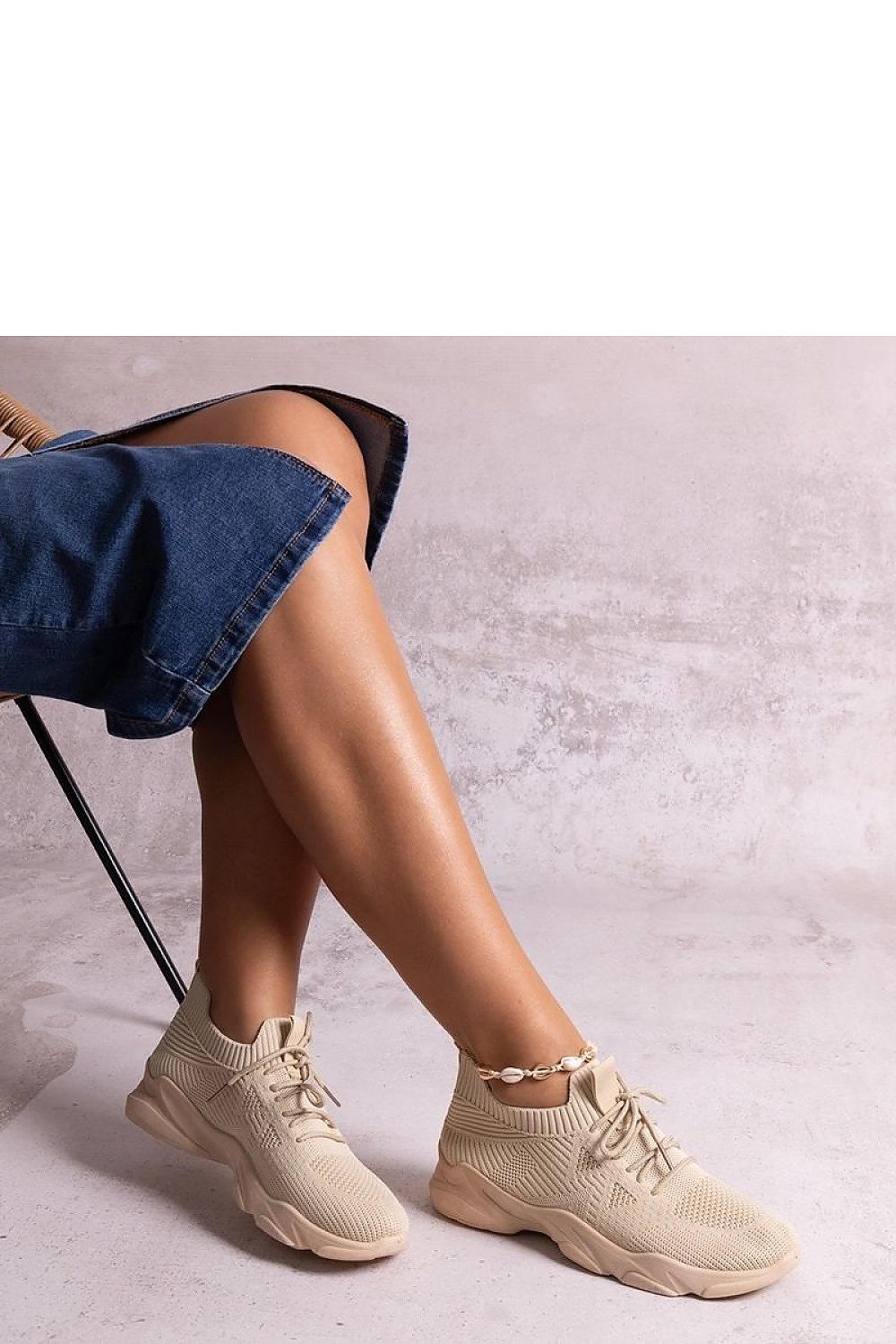 Close-up of Solea beige fabric sneakers highlighting the round toe and medium-height heel, ideal for chic summer outfits.